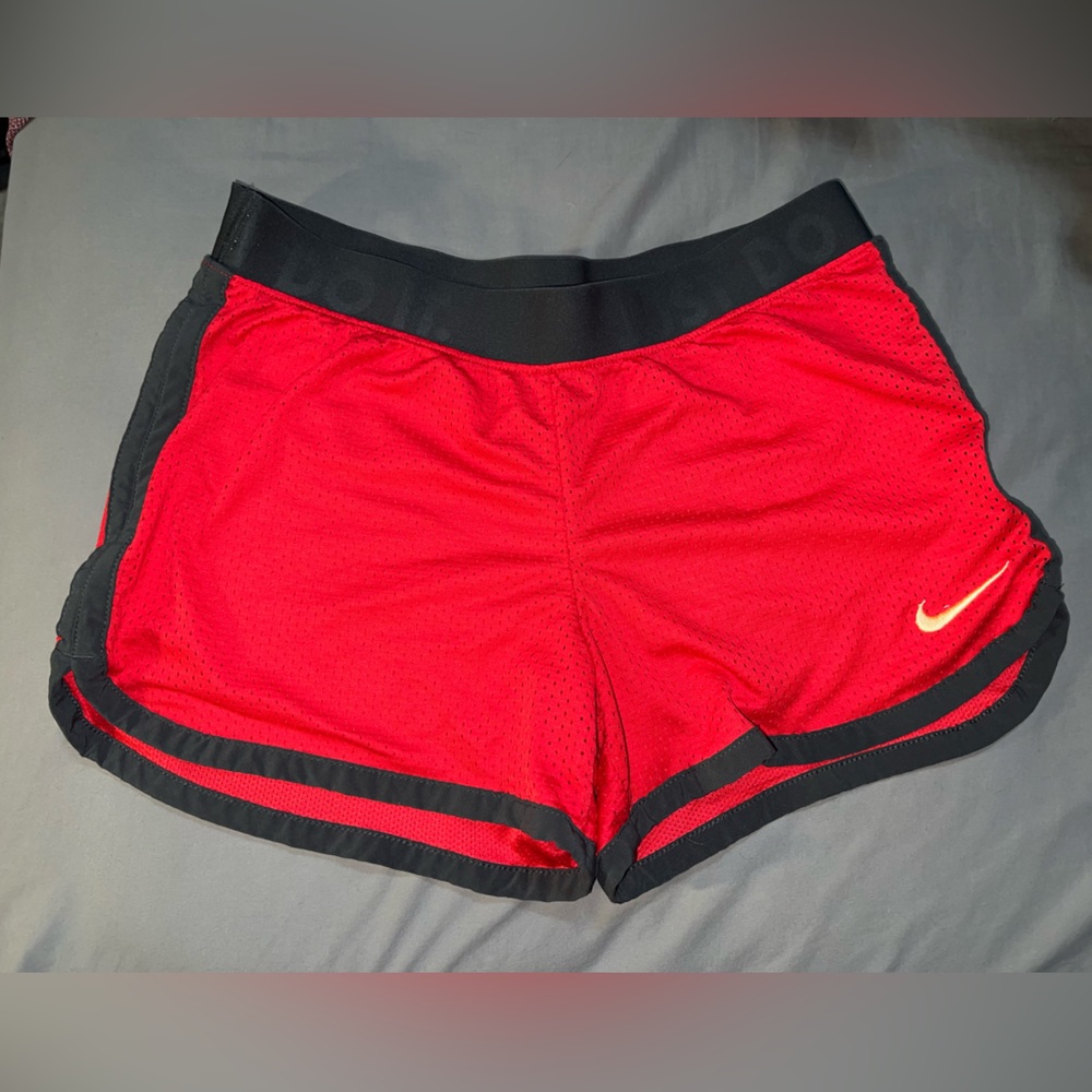 NIKE DRI-FIT gym shorts. Size S red with yellow/gold logo.